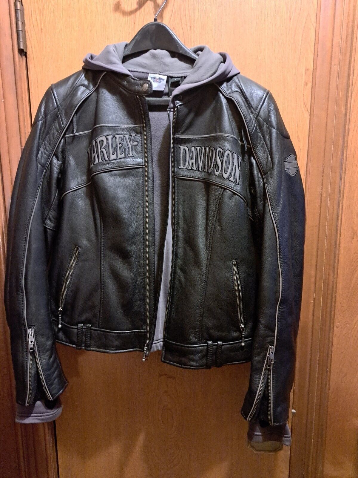 womens black leather harley davidson jacket, size lg with hoodie, slightly used