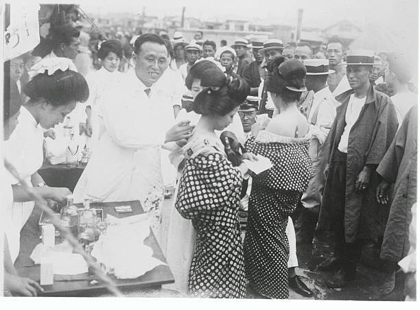 Tokyo Japan City Health officials are pictured here giving anti C - 1925 Photo