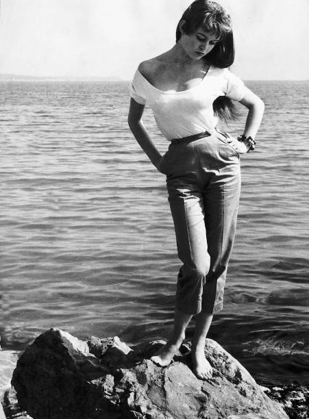 French actress Brigitte Bardot standing rocks sea shoreline C- 1955 Old Photo