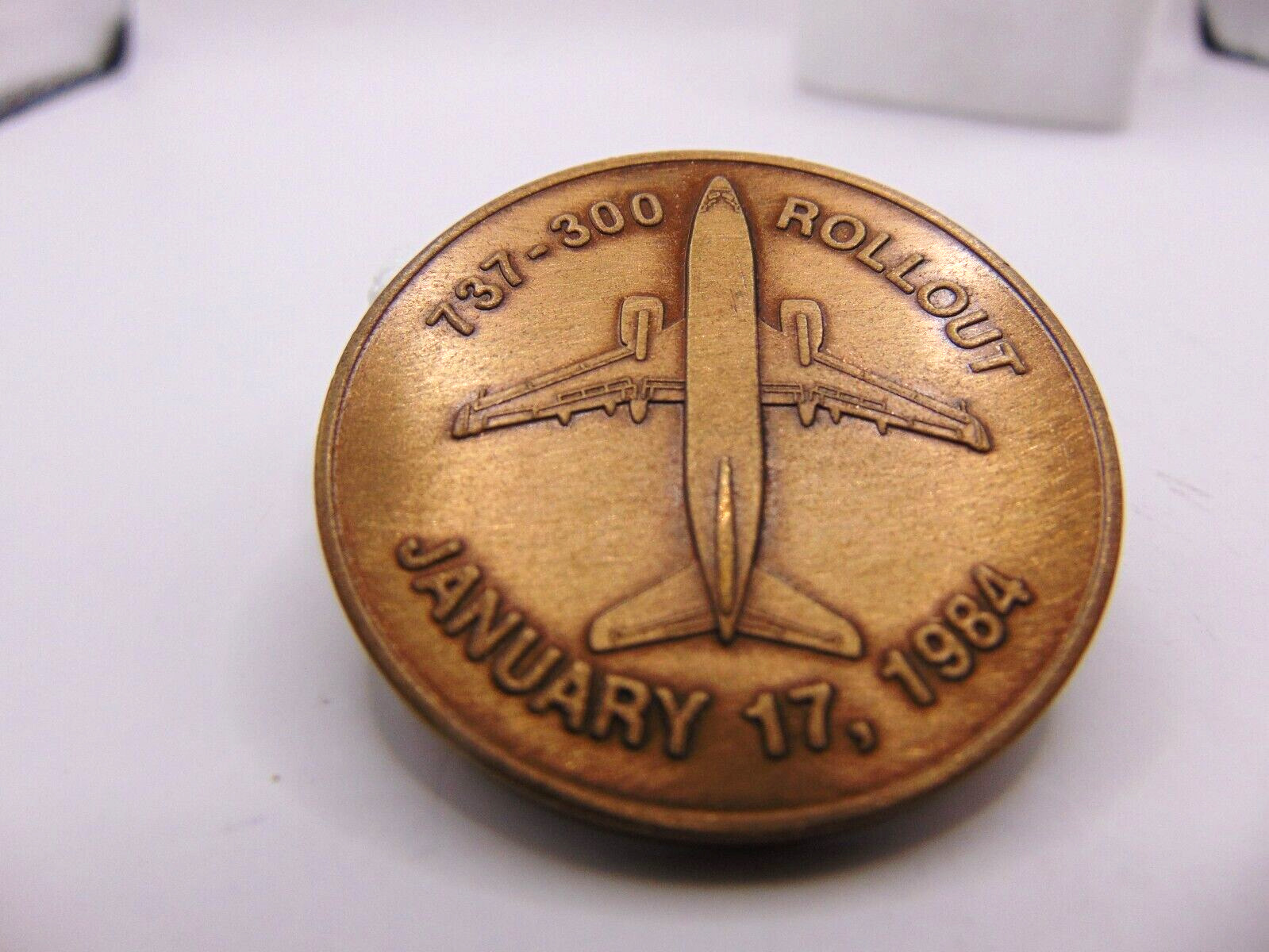 BOEING AIRPLANE METAL COIN COMMEMORATING THE ROLLOUT OF THE FIRST 737-300 1984