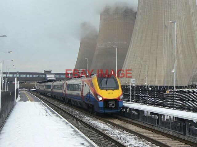 PHOTO  MERIDIAN UNIT 322 015 PULLS OUT OF EAST MIDLANDS PARKWAY WITH THE 12:18 D