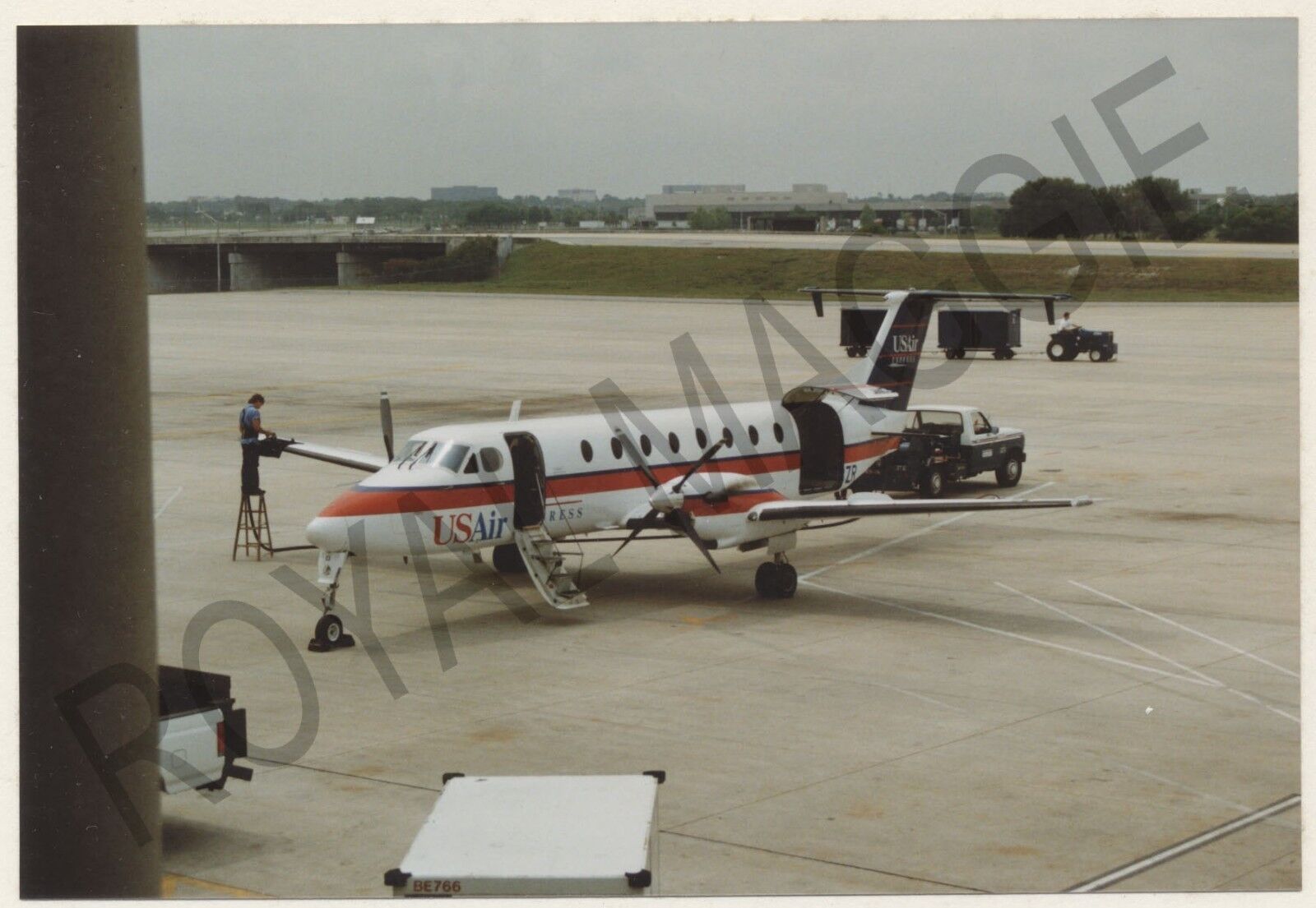 Colour print of US Air Express Beech 1900C N13ZR at Tampa FL in 1992