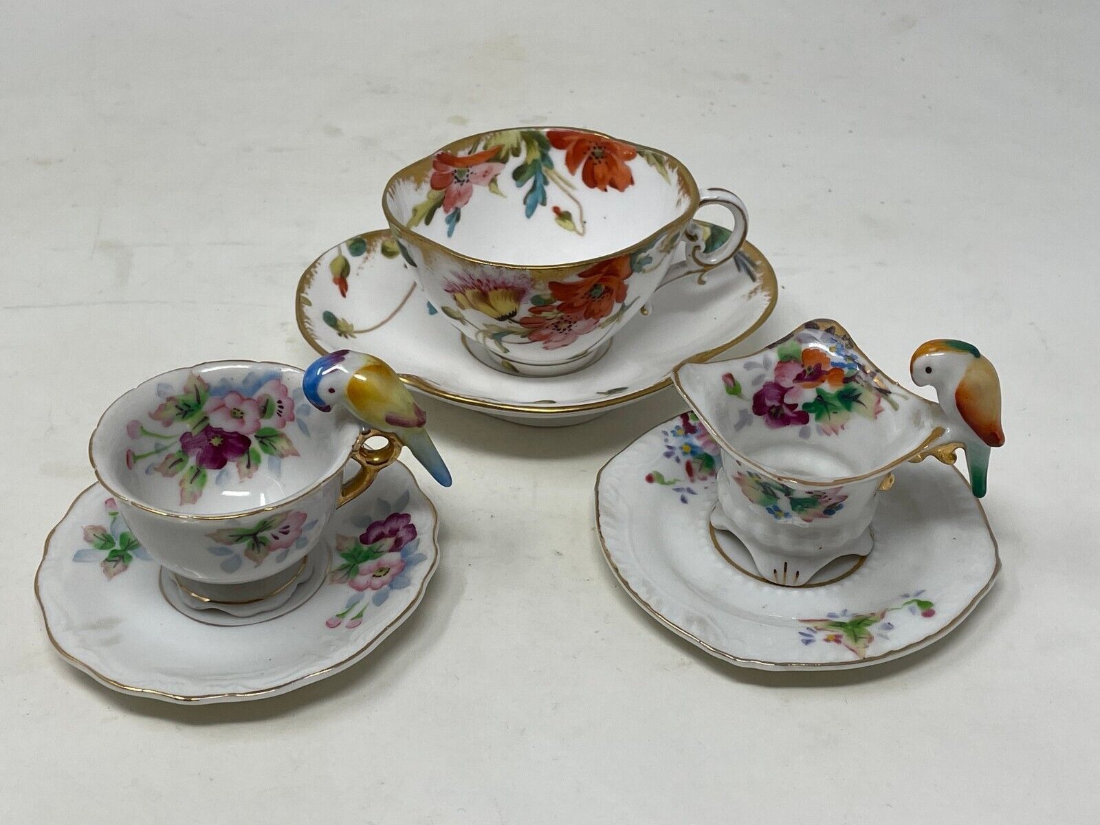 3 Vintage Mini Teacups/Saucers Japan Bird Handle hand painted with gold trim. 