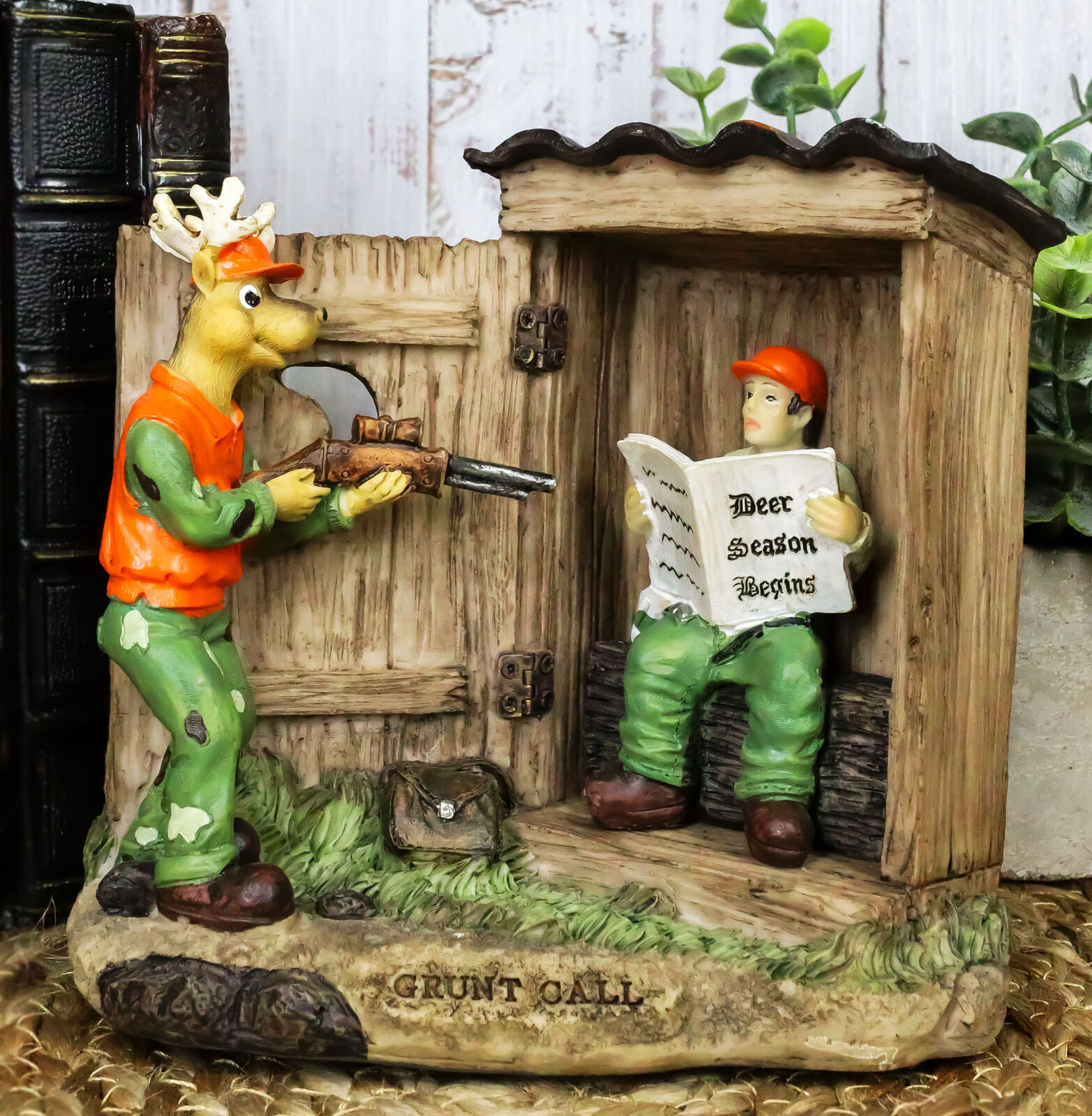 Rustic Deer With Rifle Jumping A Hunter With Newspapers In Outhouse Figurine