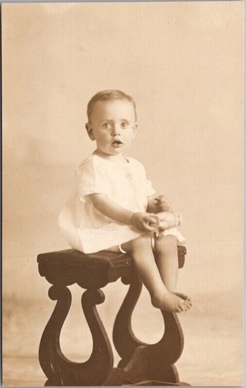 1910s RPPC Studio Photo Postcard Open-Mouthed Baby on Wooden Stool / Unused