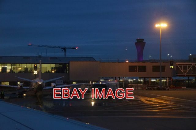 PHOTO  EDINBURGH AIRPORT AT DUSK TAKEN FROM A SHETLAND-BOUND PLANE READY FOR TAK