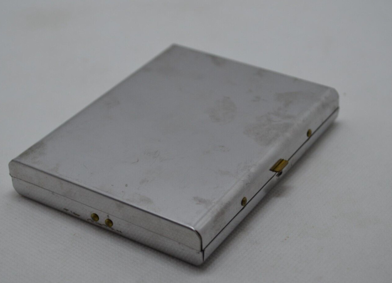 Silver tone cigarette case, signed Vandor 2008 4 X3 M2