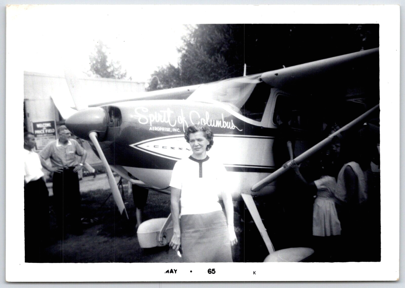 Photo Woman standing in front of Spirit of Columbus plane May 65 Cessna 180