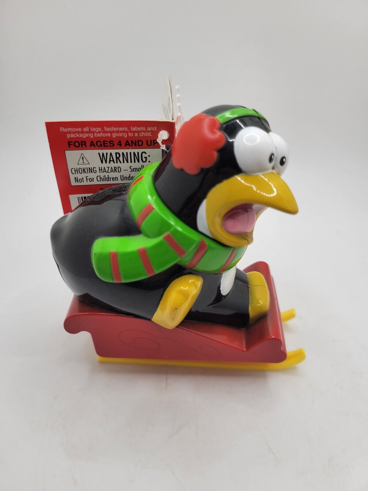 Vintage Pooping Penguin On Sleigh Holiday Toy