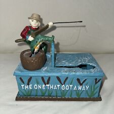 Vintage THE ONE THAT GOT AWAY fisherman Cast Iron working PIGGY PENNY BANK fish picture