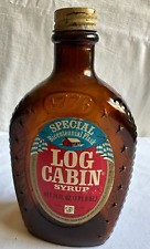 Two 1976 Vintage Log Cabin Bicentennial Syrup one with label and one without picture