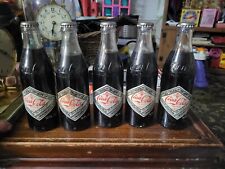 COCA COLA: 1977 75th Anniversary Commemorative Bottles, 5 Unopened picture