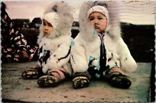 VINTAGE CONTINENTAL SIZE POSTCARD ESKIMO TWINS IN THE ARCTIC REGION OF ALASKA picture