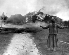 Russian Woman watches her home burn 8