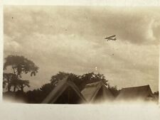 WH Photograph Plane Airplane Flying Over Tops Of Tents Artistic POV View 193-40s picture