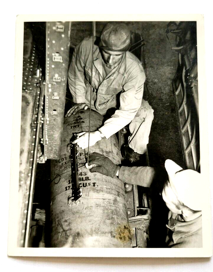 WWII Era Soldier Loading Bombs in Bomber Airplane Original Photo