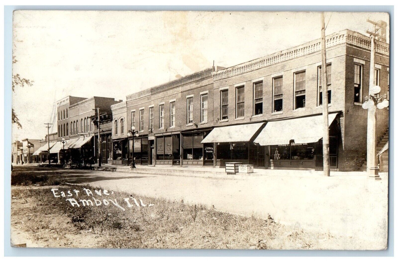 1916 East Avenue Saloon Stores Amboy Illinois IL RPPC Photo Antique Postcard
