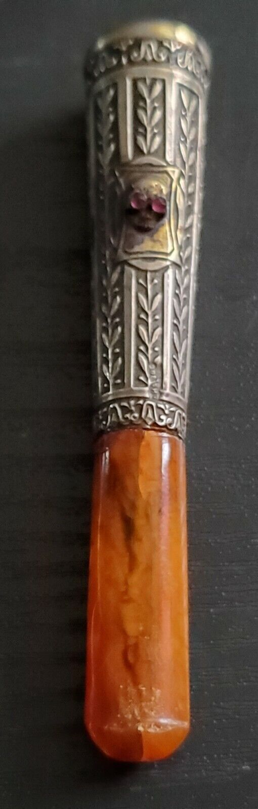 Antique engraved gold/silver and ruby eyes Butterscotch amber mouthpiece.