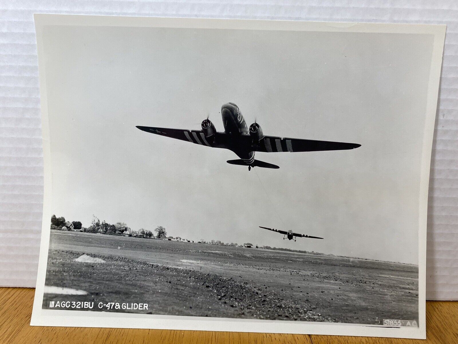 Douglas C-47D Skytrain Troop carrier C-47 on takeoff with a glider in tow.