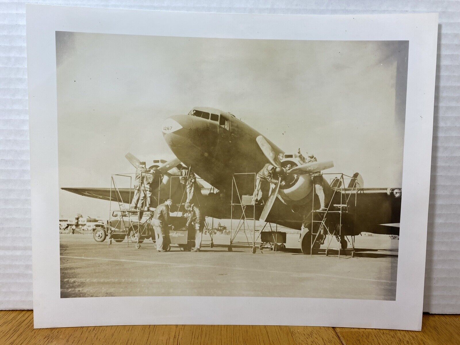 Douglas C-47D Skytrain AIRCRAFT“GOONEY BIRD” BEING WORKED BY SERVICE MEN.