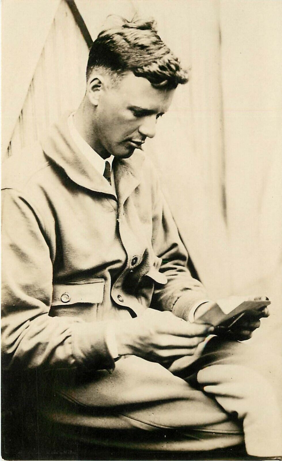 RPPC Postcard Charles Lindbergh in Flight Suit reading Papers, France, Underwood