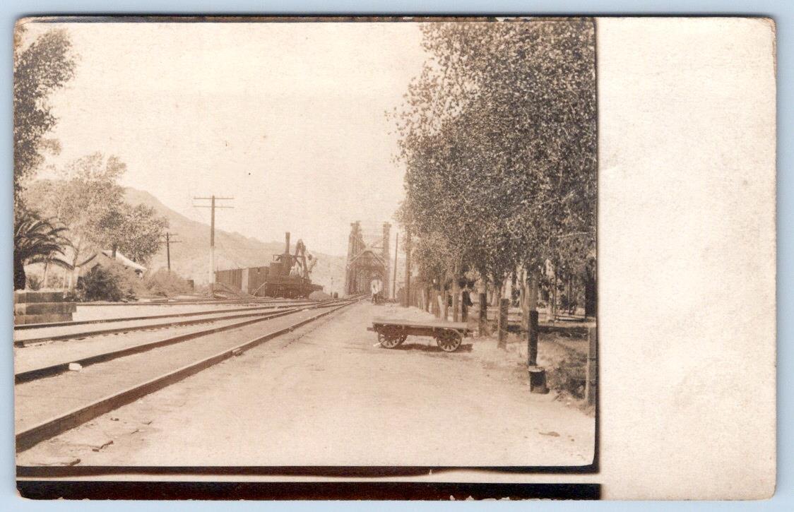 1910's RPPC RAILROAD TRACKS STEEL BRIDGE MOUNTAIN UNKNOWN LOCATION POSTCARD