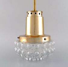 Helena Tynell for Limburg. Ceiling pendant in clear art glass and brass. 1970s. picture