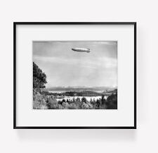 c1932 photograph of The sky canoe Summary: U.S.S. Akron, U.S. Navy airship, over picture