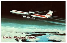 TWA  Jumbo Jet in Flight Wichita Municipal Airport Postcard picture