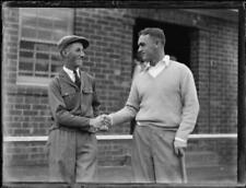 H.W. Hattersley and Alan Waterson shaking hands after a golf game,- Old Photo picture